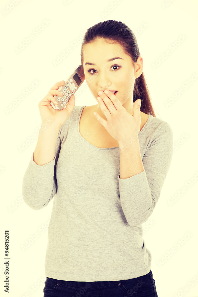 Shocked woman talking on the phone. Shocked woman talking on the phone.