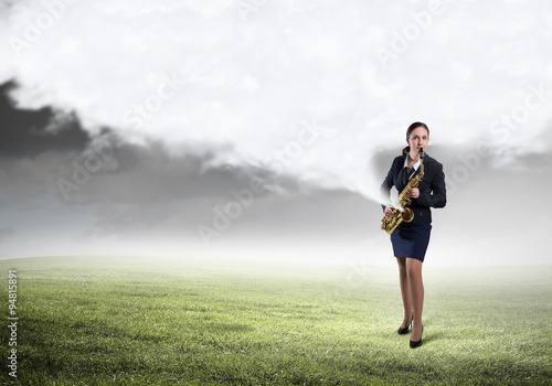 Woman saxophonist. Concept image © Sergey Nivens