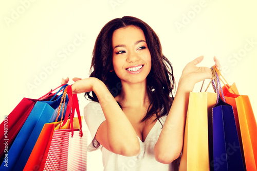 Happy smiling woman with shopping bags.