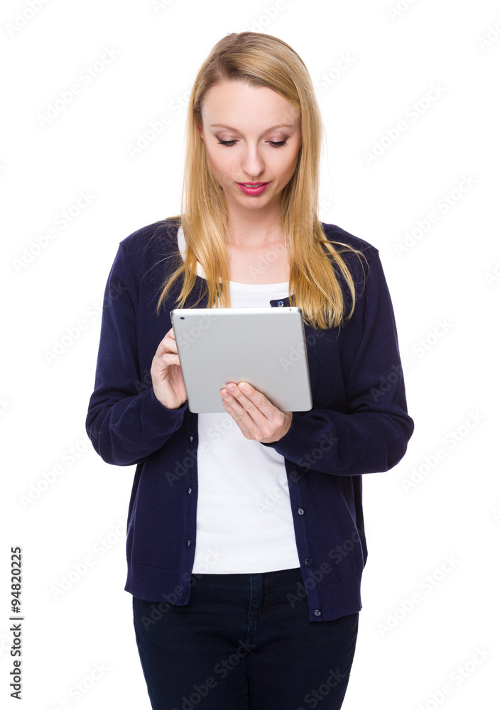 Caucasian young woman read on the tablet pc Caucasian young woman read on the tablet pc
