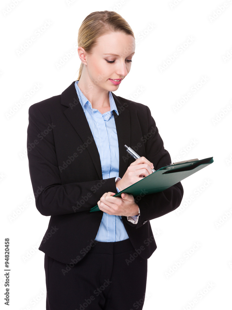 Caucasian young businesswoman take note on clipboard Caucasian young businesswoman take note on clipboard