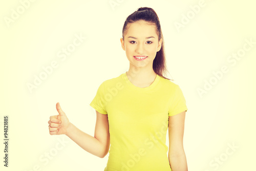 Happy woman with thumbs up.