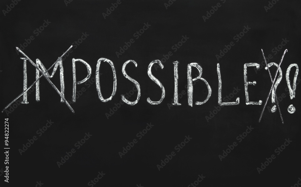 Impossible written with white chalk on a blackboard