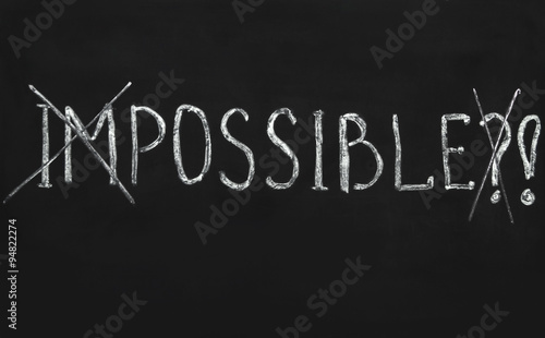Impossible written with white chalk on a blackboard