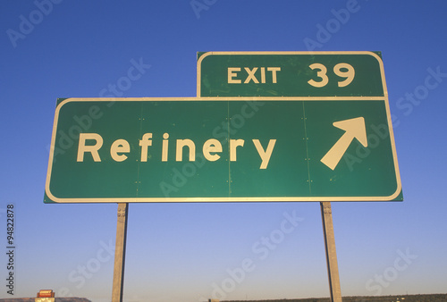 A sign that reads ÒExit 39 - RefineryÓ