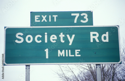A sign that reads ÒSociety Rd 1 mileÓ