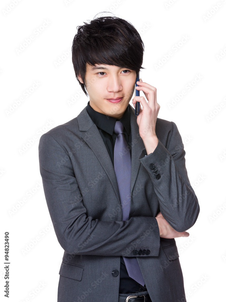 Asian Young Businessman talk to cellphone Asian Young Businessman talk to cellphone
