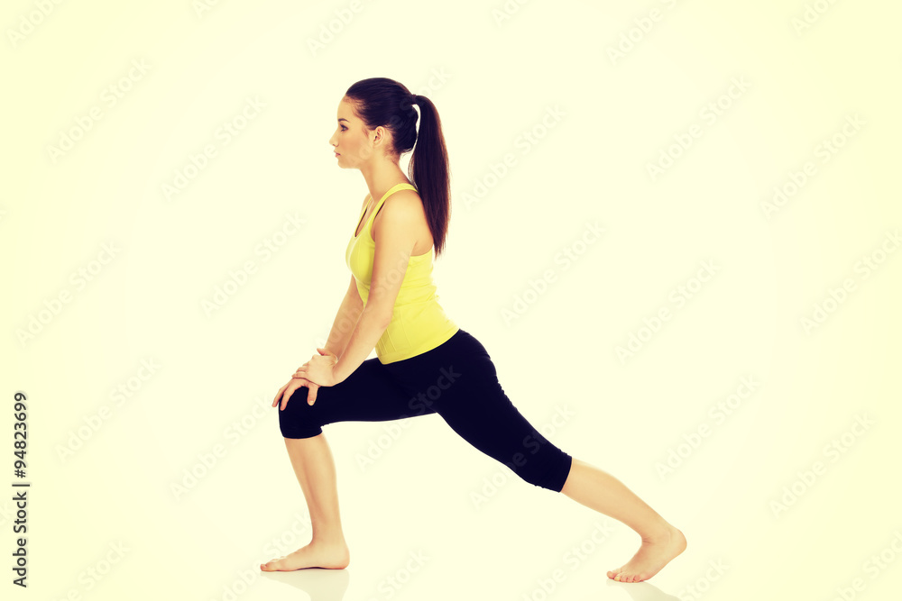 Fitness woman doing stretching exercise. Fitness woman doing stretching exercise.