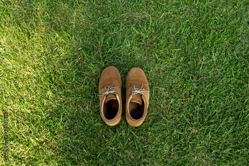 old shoes over the grass field