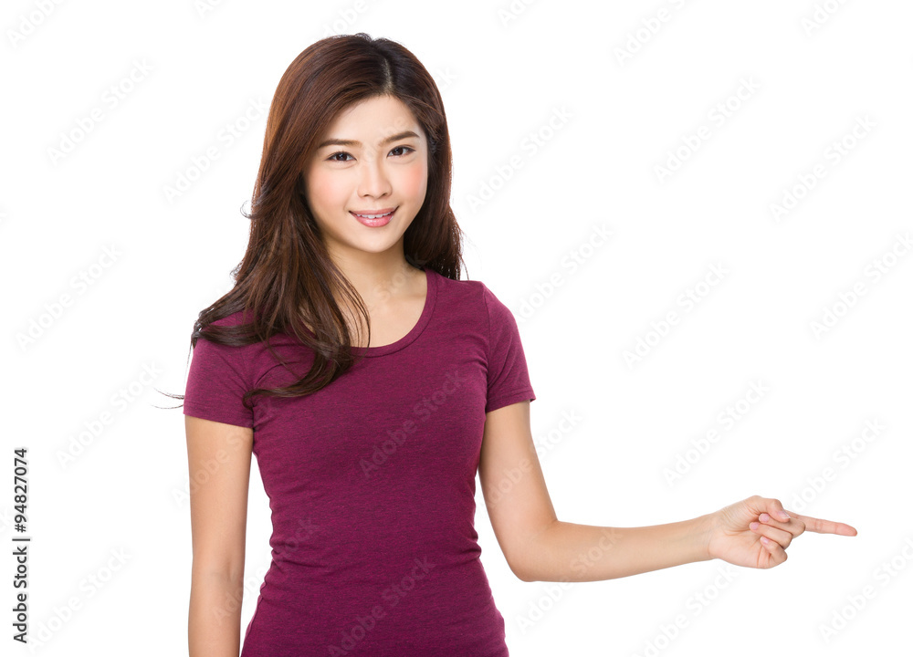 Young woman with finger point aside Young woman with finger point aside