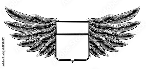 Vintage woodcut winged shield