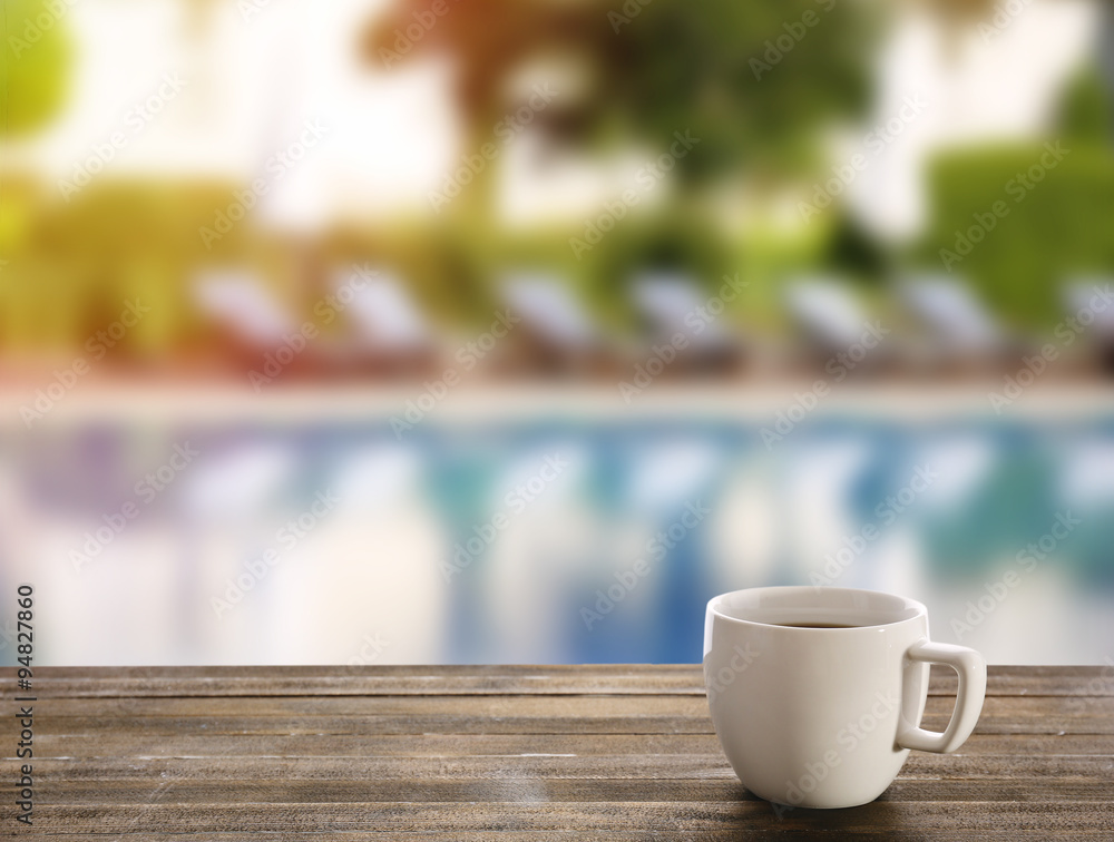 Cup of coffee on table on bright background Cup of coffee on table on bright background