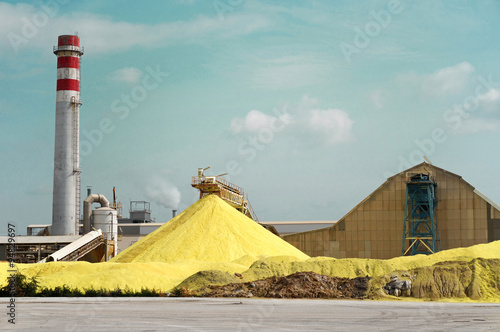 Sulfur Factory / A Yellow Pile of Sulfur Produced in an Industrial Facility photo