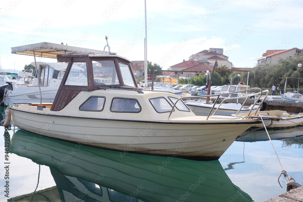 Fototapeta premium The image of an passenger motor boat in a hubborn of Tivat, Montenegro