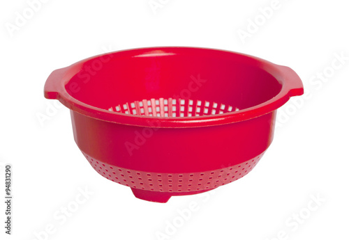 Red empty colander isolated
