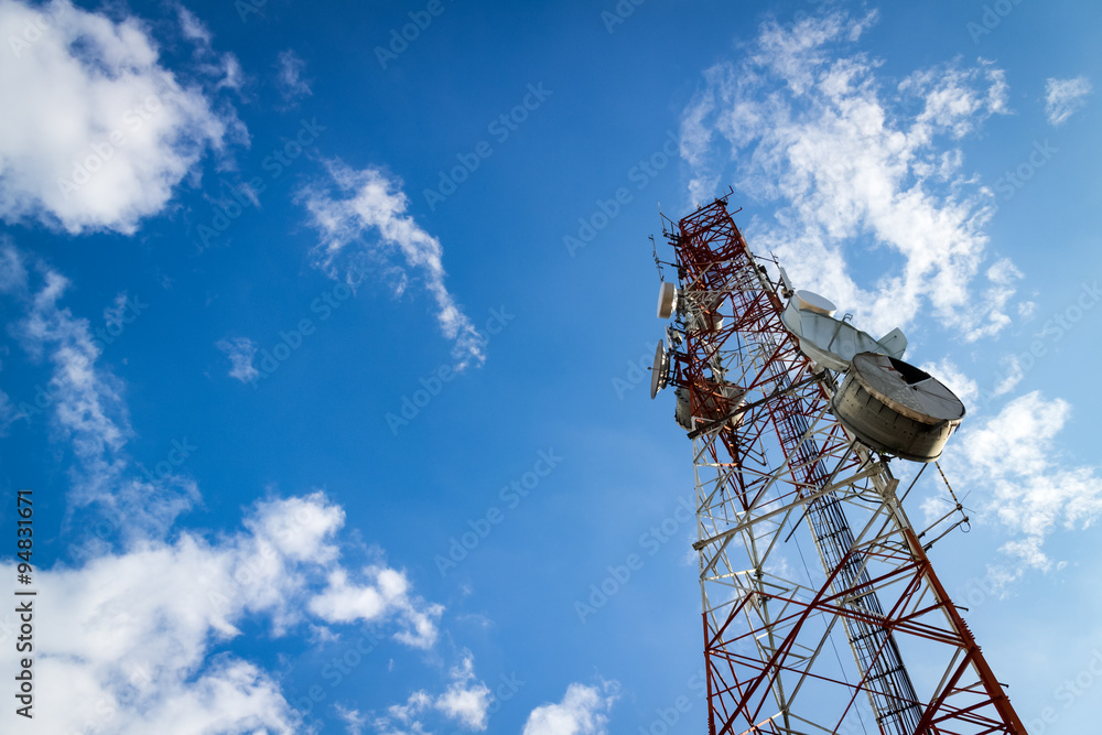 Communications Tower with cloud and blue sky