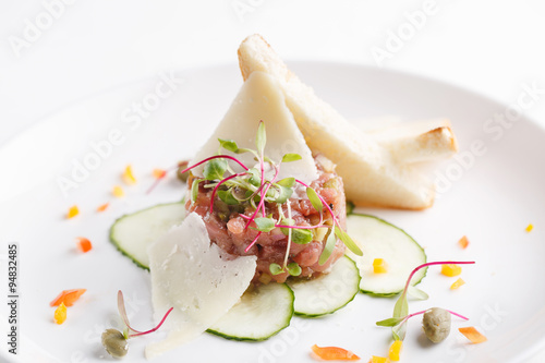 veal tartare appetizer on the plate. close up.