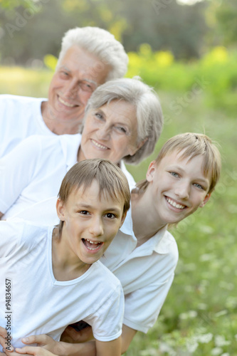 Boys with grandparents   in summer