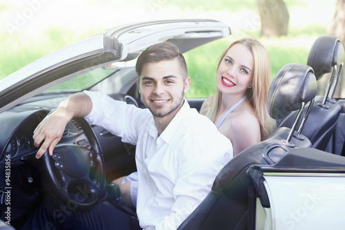 Young couple in cabriolet, ...