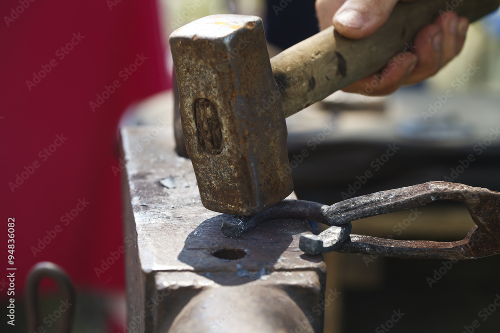 blacksmith makes a horseshoe close-up blacksmith makes a horseshoe close-up
