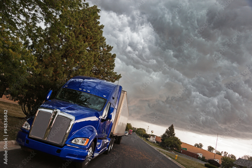 Semi Truck under heavy clouds