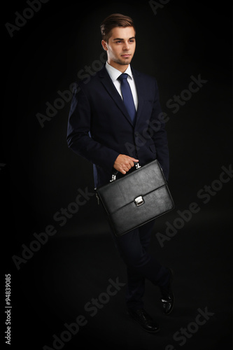 Elegant man in suit with br...