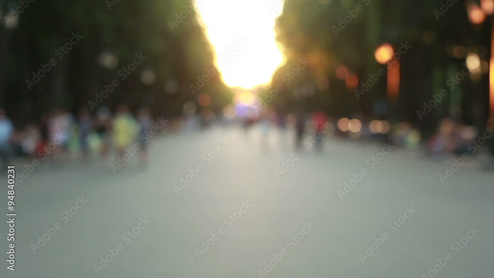 People going through the summer park blurry fast mode People going through the summer park blurry fast mode