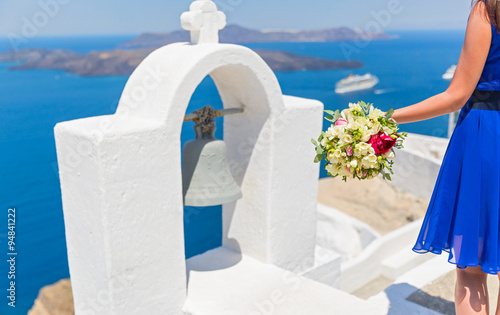 Woman withbouquet on the  island  Santorini