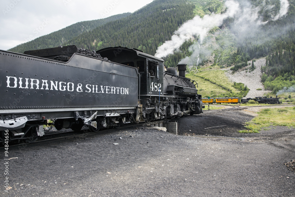 Obraz premium Two trains, Durango and Silverton Narrow Gauge Railroad featuring Steam Engine, Silverton, Colorado, USA, 07.07.2014