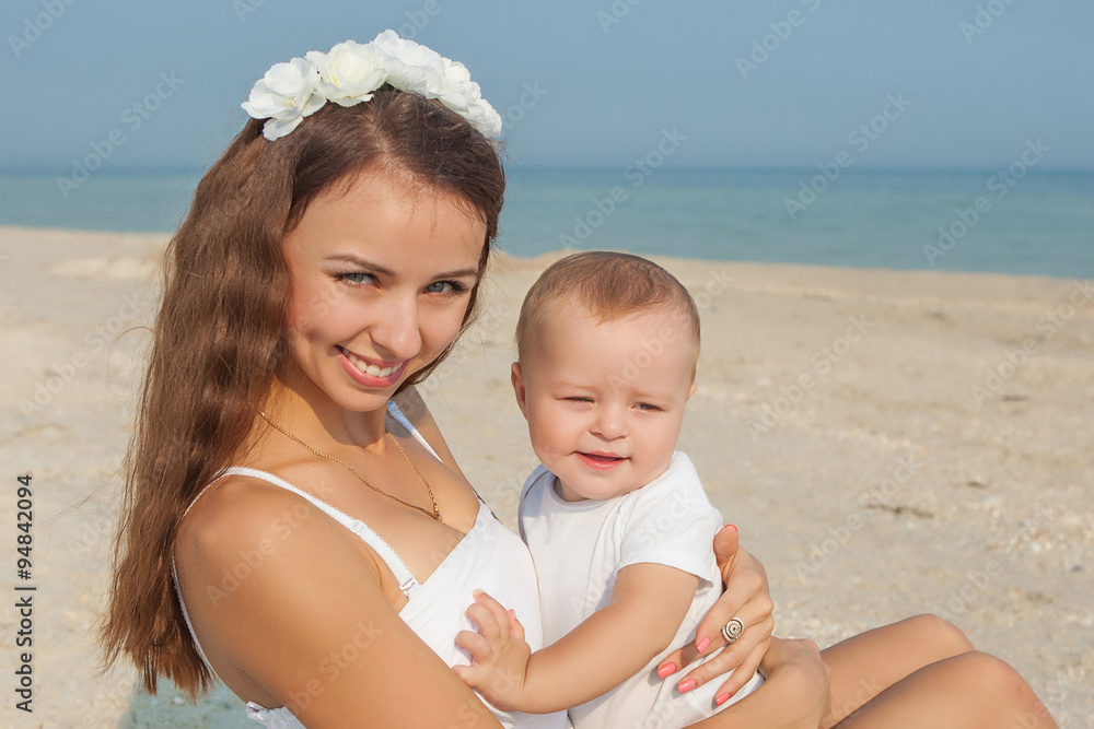 Mother and her son having fun on the beach Mother and her son having fun on the beach