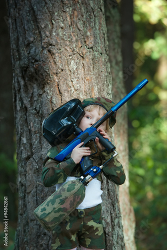 photo of little girl with rifle