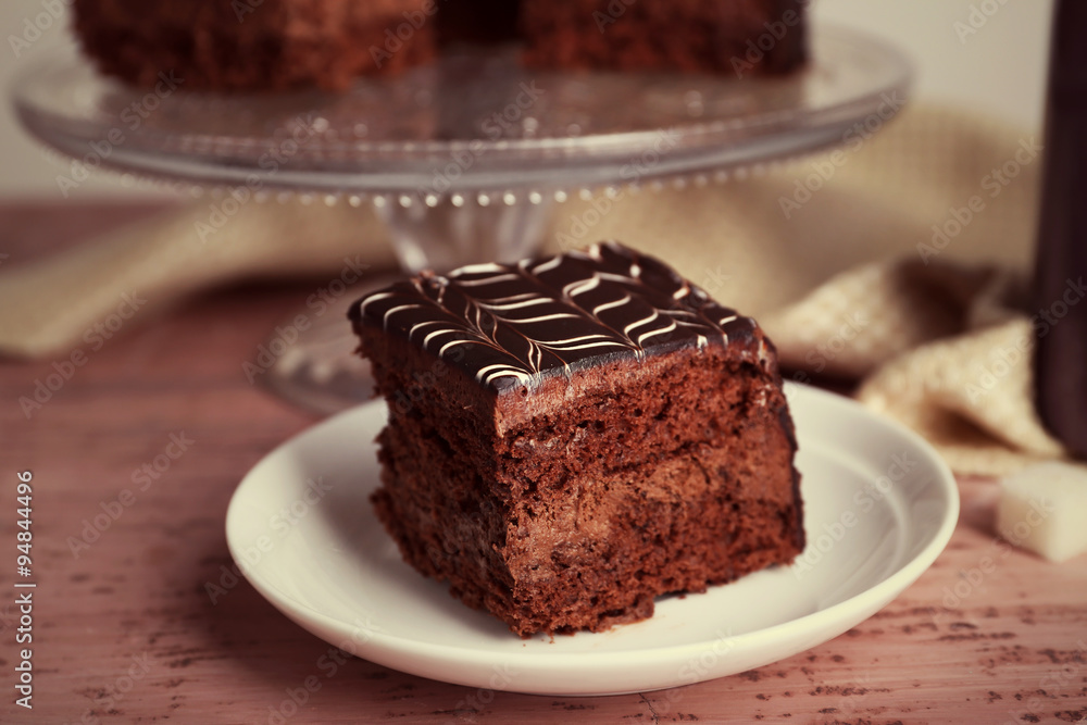 Served table with chocolate cake on wooden background Served table with chocolate cake on wooden background
