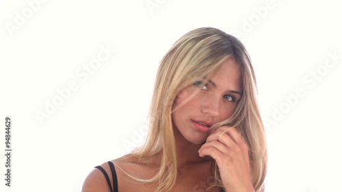 Beauty woman flirting and posing in studio at white background