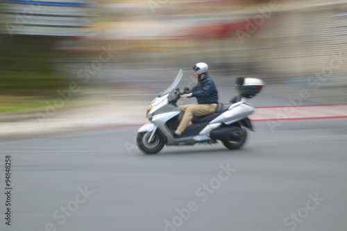 Man riding moped in Nice, France © spiritofamerica