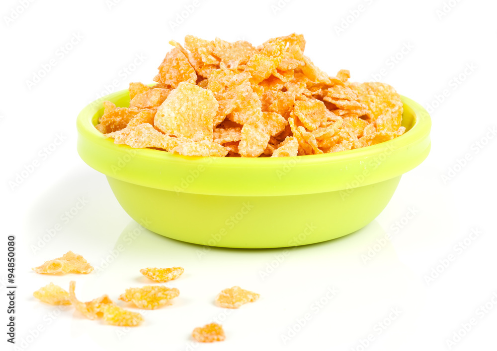 Cornflakes in porcelain bowl isolated on white background Cornflakes in porcelain bowl isolated on white background