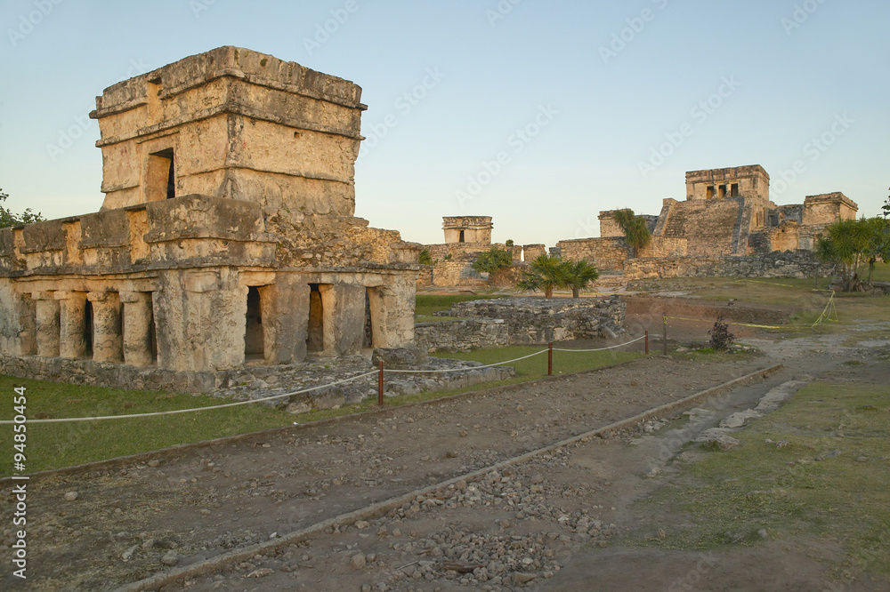 Temple of the Frescoes at the Mayan ruins of Ruinas de Tulum (Tulum Ruins). El Castillo is pictured in the background, in Quintana Roo,Yucatan Peninsula, Mexico. Temple of the Frescoes at the Mayan ruins of Ruinas de Tulum (Tulum Ruins). El Castillo is pictured in the background, in Quintana Roo,Yucatan Peninsula, Mexico.