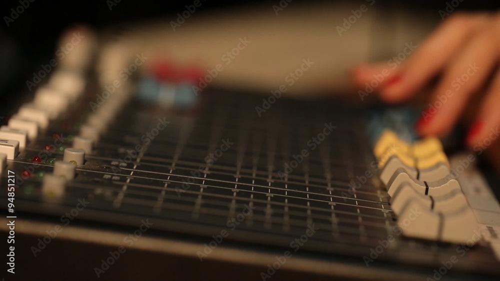 Hand on a mixer, operating the leader Hand on a mixer, operating the leader