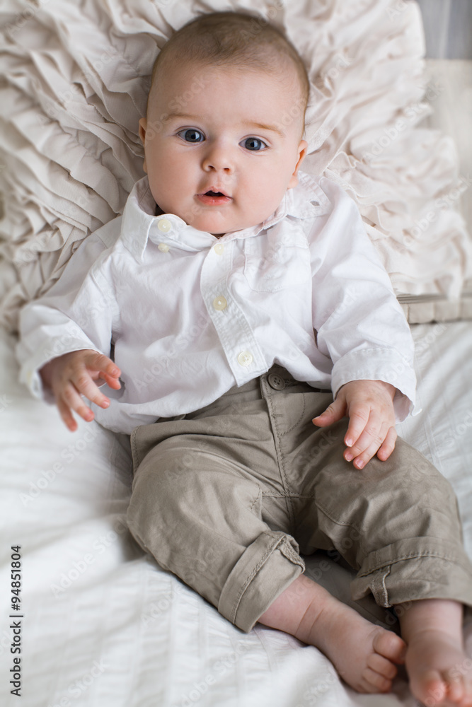 Cute baby boy with big blue eyes. Stock Photo | Adobe Stock