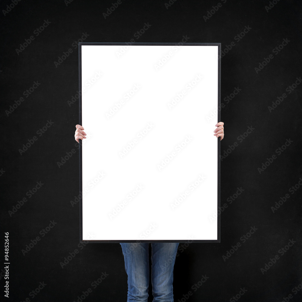 woman with blank poster on wall background woman with blank poster on wall background