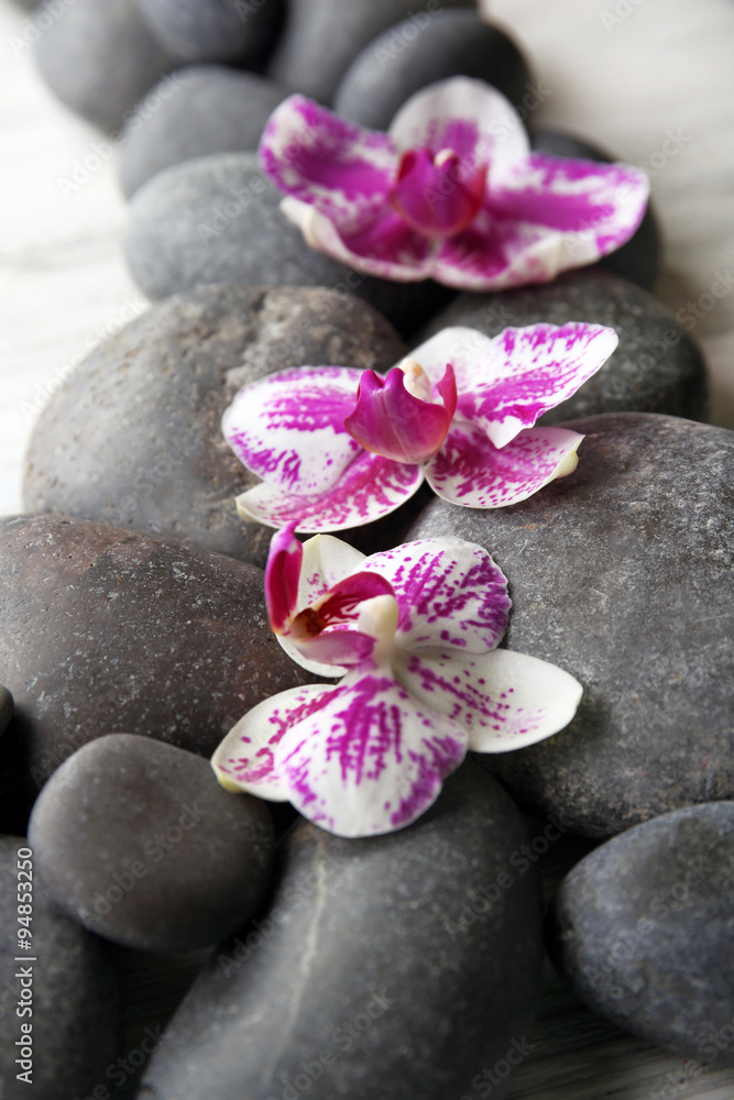 Fototapeta premium Spa stones and orchids closeup