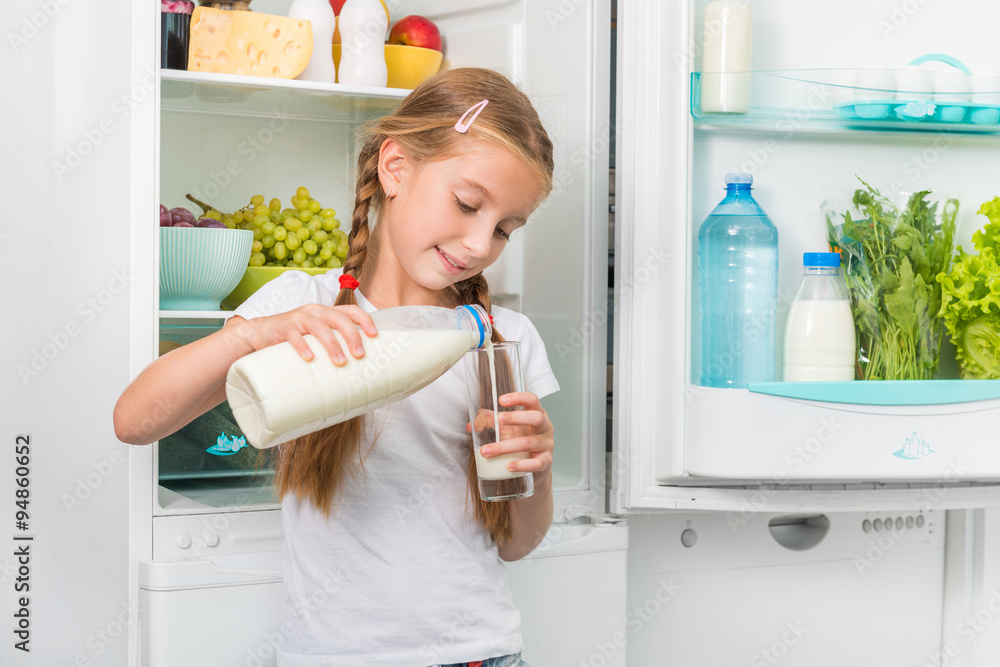 little girl pouring milk in glass little girl pouring milk in glass