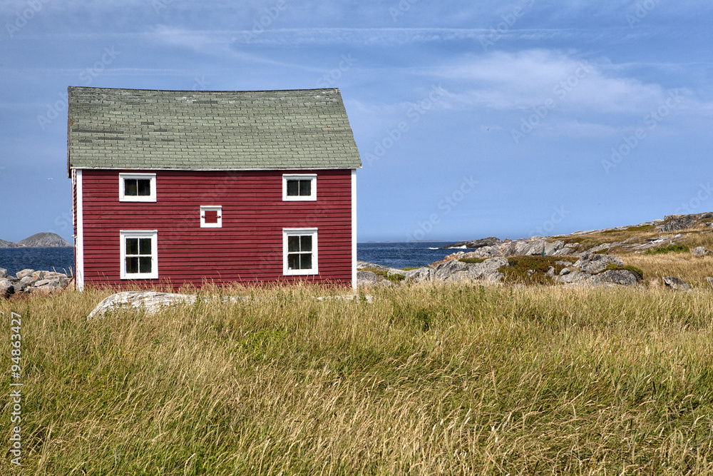 Tilting / Abandoned house with a disintegrating dory in front of it sits on the coastline in the town of Tilting on Fogo Island, Newfoundland and Labrador Tilting / Abandoned house with a disintegrating dory in front of it sits on the coastline in the town of Tilting on Fogo Island, Newfoundland and Labrador