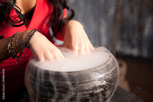 Hands witch in a magic potion