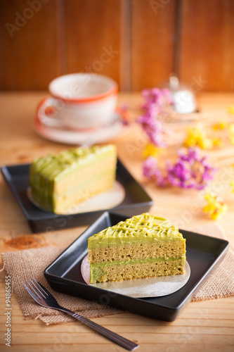 Green tea cake on wood table
