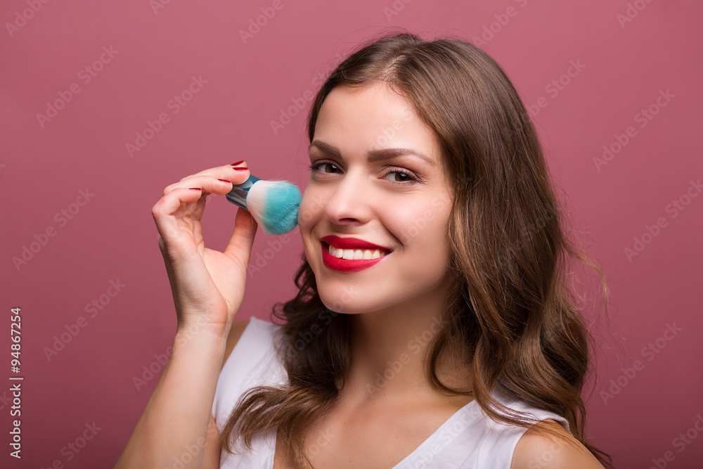 Beautiful woman with cosmetic brush Beautiful woman with cosmetic brush