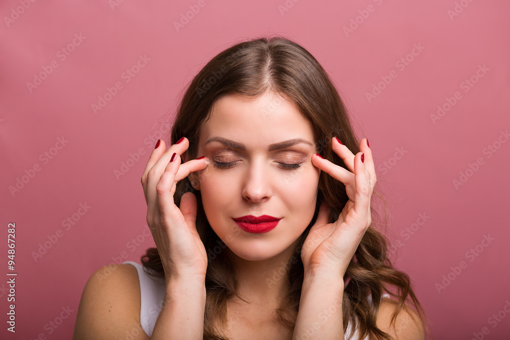 Woman applying an eye cream Woman applying an eye cream