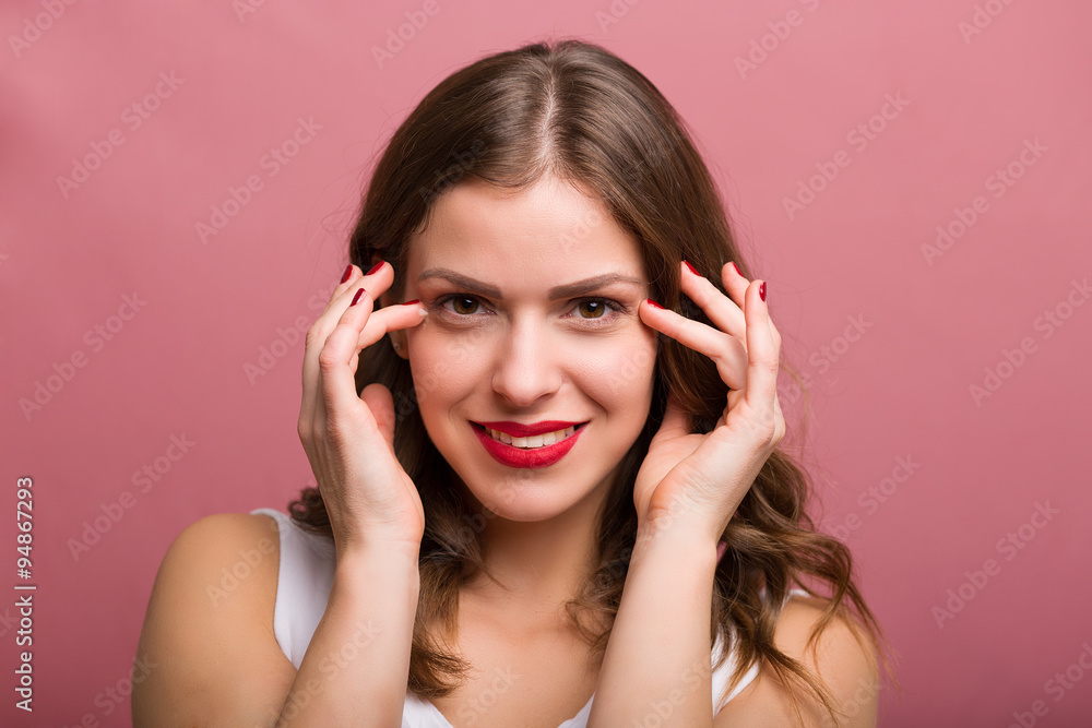 Woman applying an eye cream