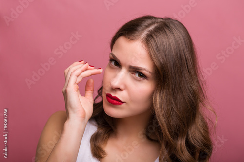 Woman applying an eye cream