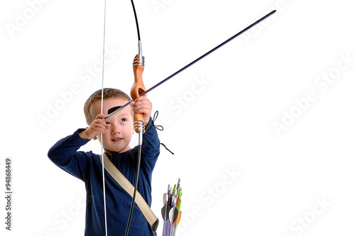 Happy 3 years old boy, holding a handmade bow with an arrow and