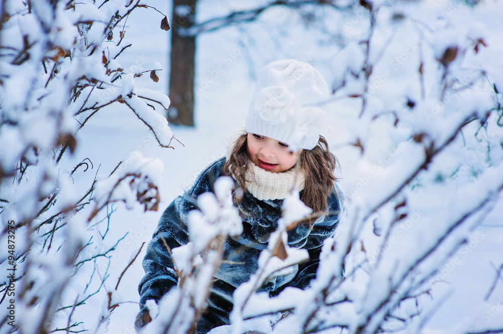 child girl on cozy winter forest walk child girl on cozy winter forest walk